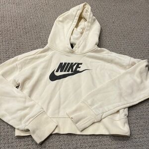 Cream colored large cropped sweater with a hood
